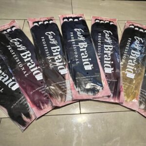 A bunch of different colored hair extensions in packages.