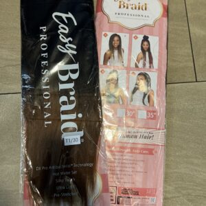 A package of hair extensions on the floor.